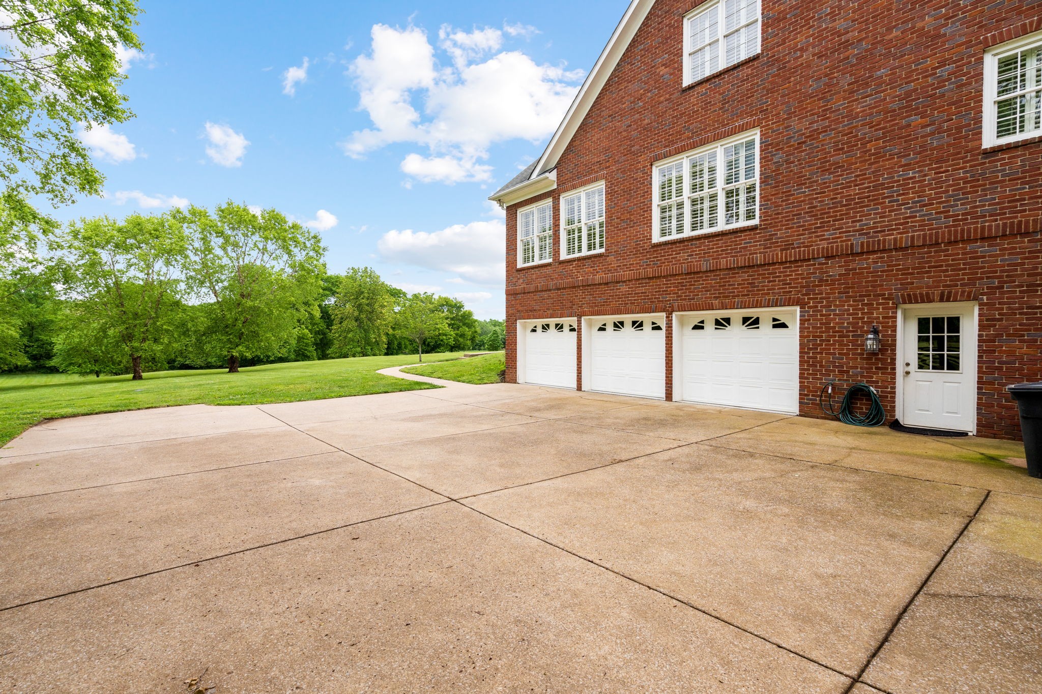 3210 Kinnard Springs Road Franklin, TN 37064 - Photo 53 of 64 a view of a house with a yard and garage
