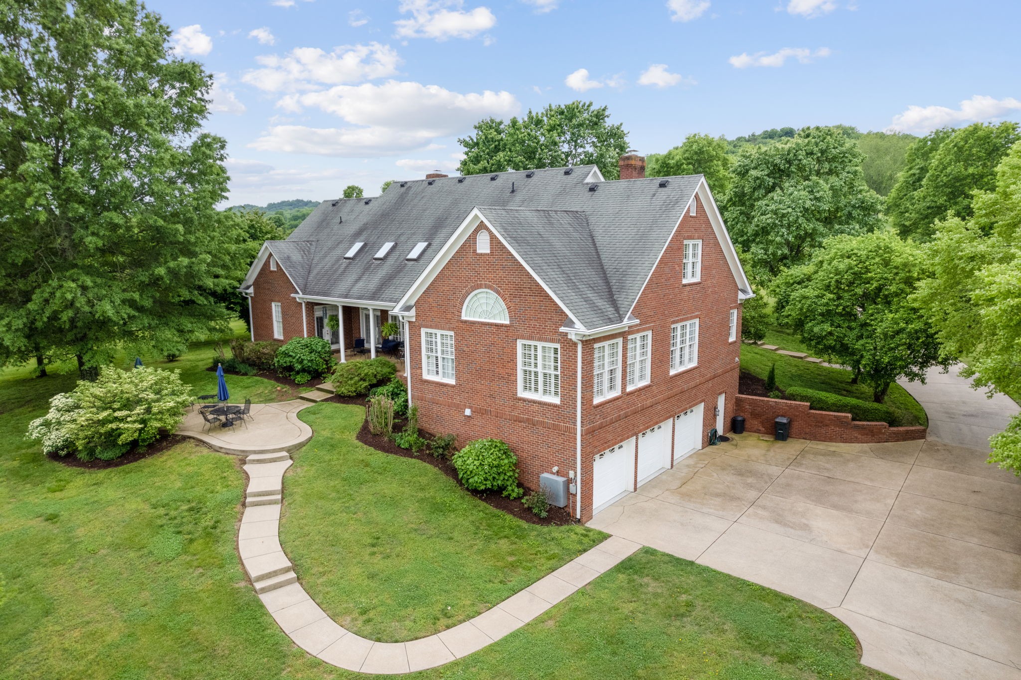 3210 Kinnard Springs Road Franklin, TN 37064 - Photo 61 of 64 a aerial view of a house with a yard and potted plants