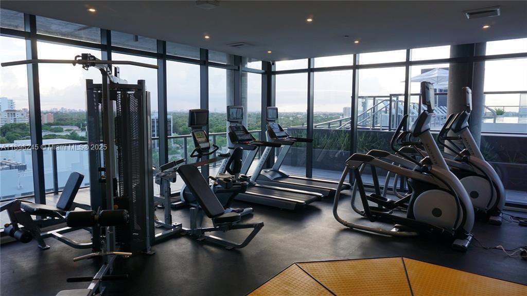 201 Southwest 17th Road, Unit 603 Miami, FL 33129 - Photo 15 of 23 a view of a room with gym equipment