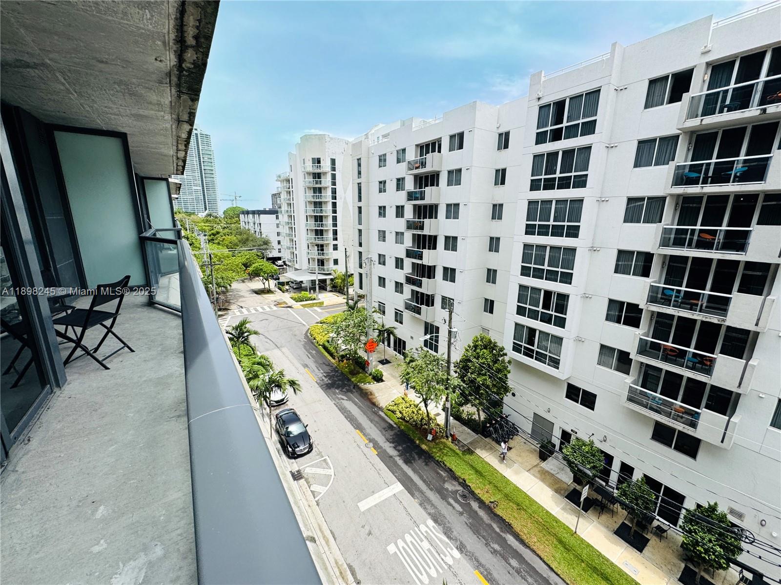 201 Southwest 17th Road, Unit 603 Miami, FL 33129 - Photo 8 of 23 a view of a balcony with chairs and potted plants