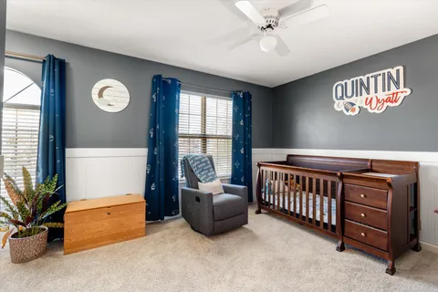 a bedroom with furniture and a window