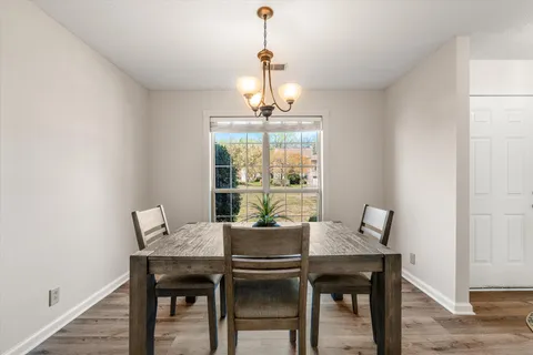 a view of a dining room with furniture window and outside view