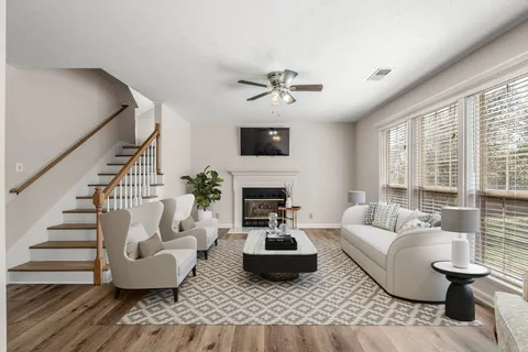 a living room with furniture and a fireplace