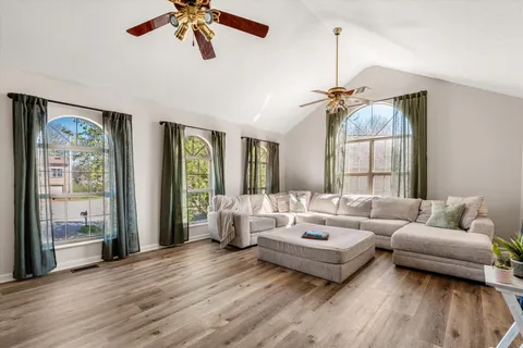 a living room with furniture and a large window