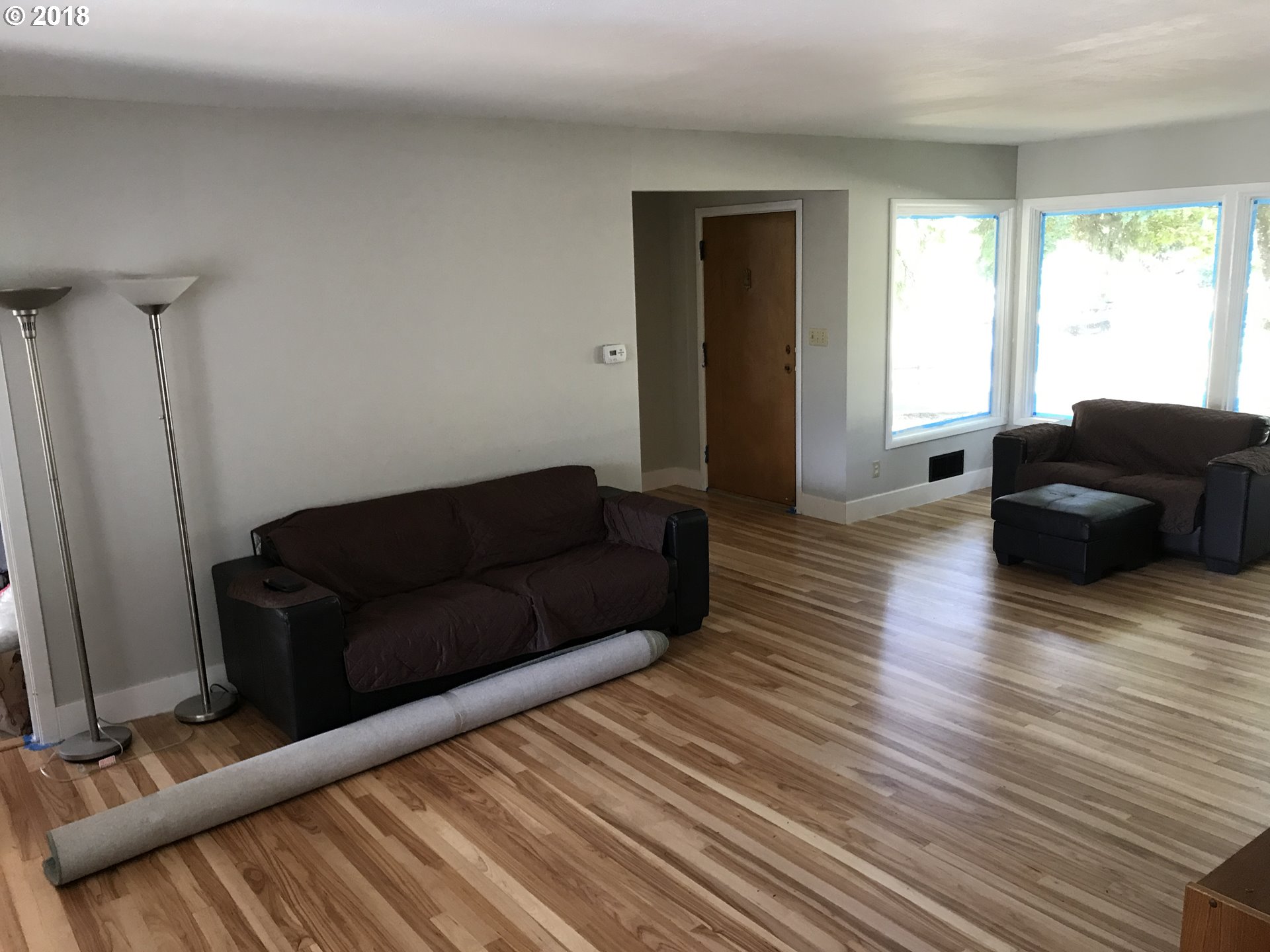 13275 Southwest Davies Road Beaverton, OR 97008 - Photo 7 of 22 a living room with furniture and a flat screen tv