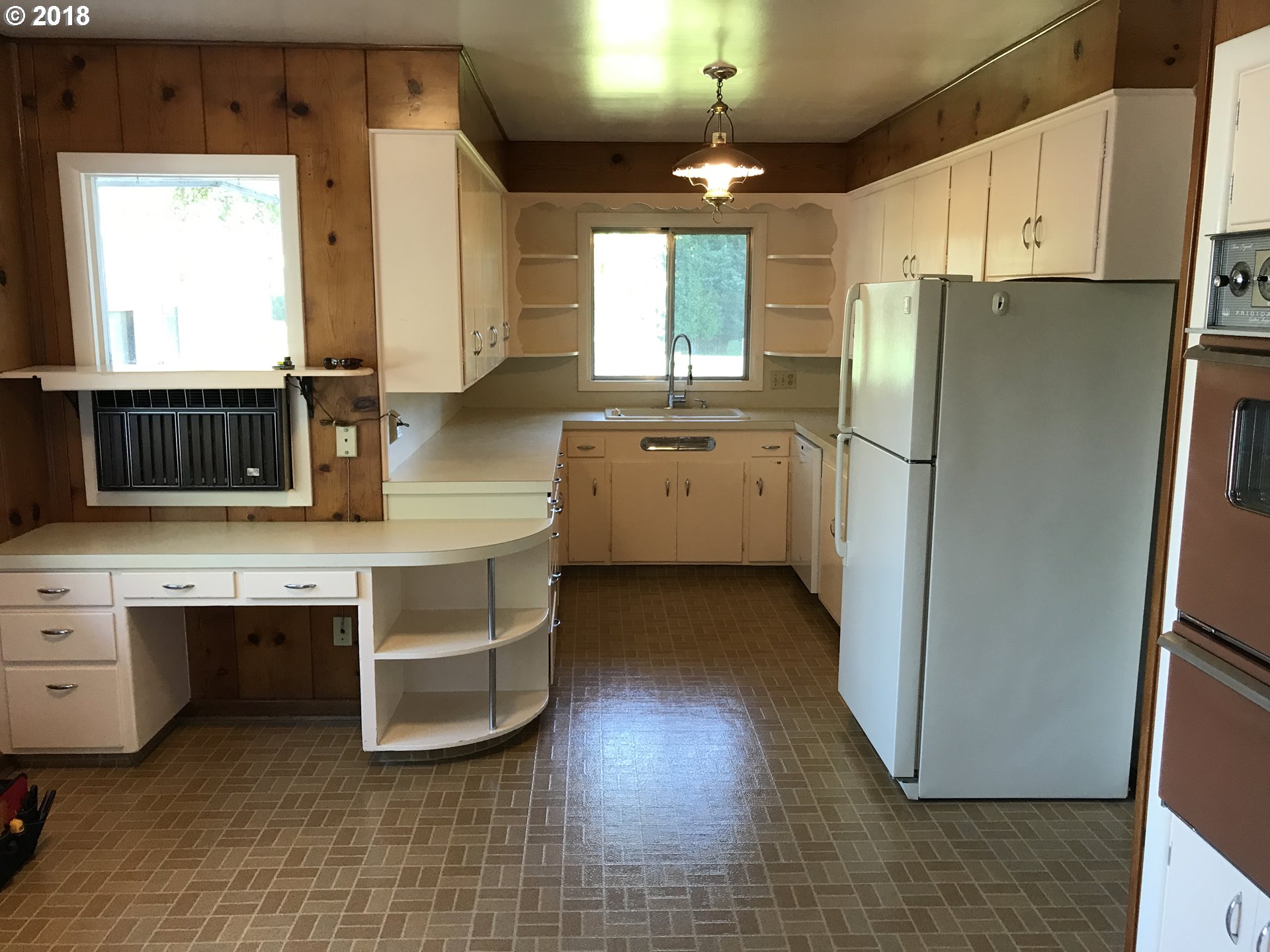 13275 Southwest Davies Road Beaverton, OR 97008 - Photo 9 of 22 a kitchen with a refrigerator sink and cabinets