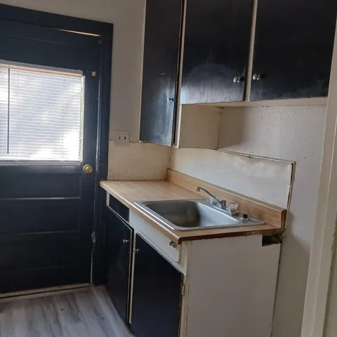 a kitchen with a stove and a microwave