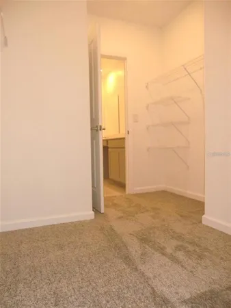 an empty room with a bathroom