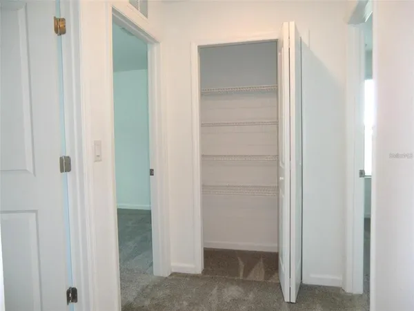 a view of an empty walk in closet