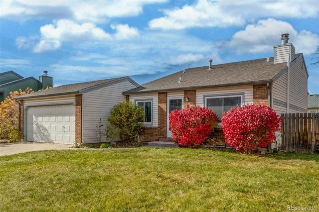a front view of house with yard and seating