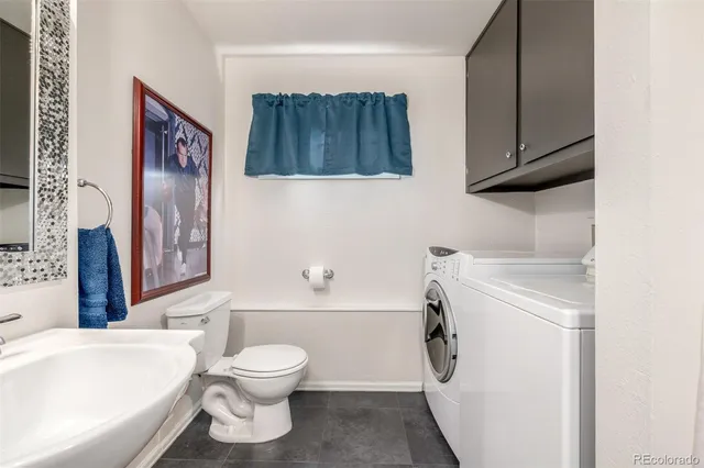 a bathroom with a toilet sink and a bathtub