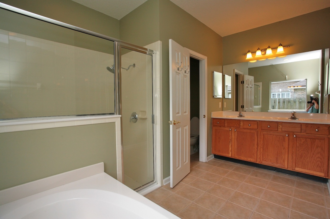 2536 Benjamin Road Jacksonville, FL 32223 - Photo 12 of 25 a bathroom with a sink mirror and a shower