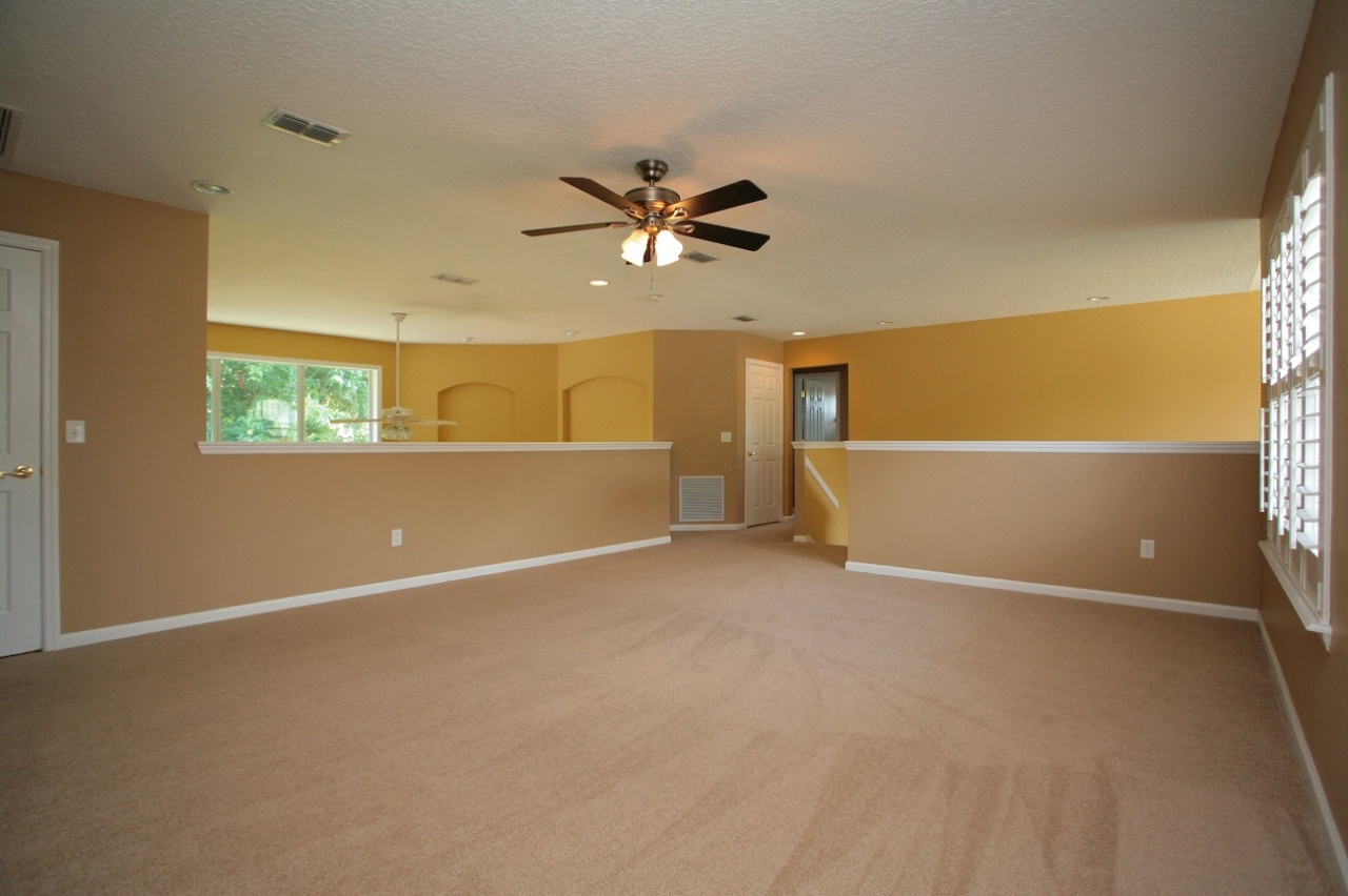 2536 Benjamin Road Jacksonville, FL 32223 - Photo 18 of 25 an empty room with windows and fan
