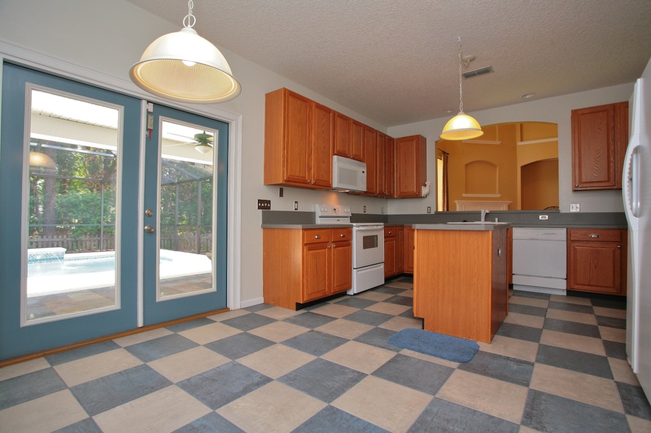 2536 Benjamin Road Jacksonville, FL 32223 - Photo 5 of 25 a kitchen with stainless steel appliances granite countertop a stove a sink and a refrigerator