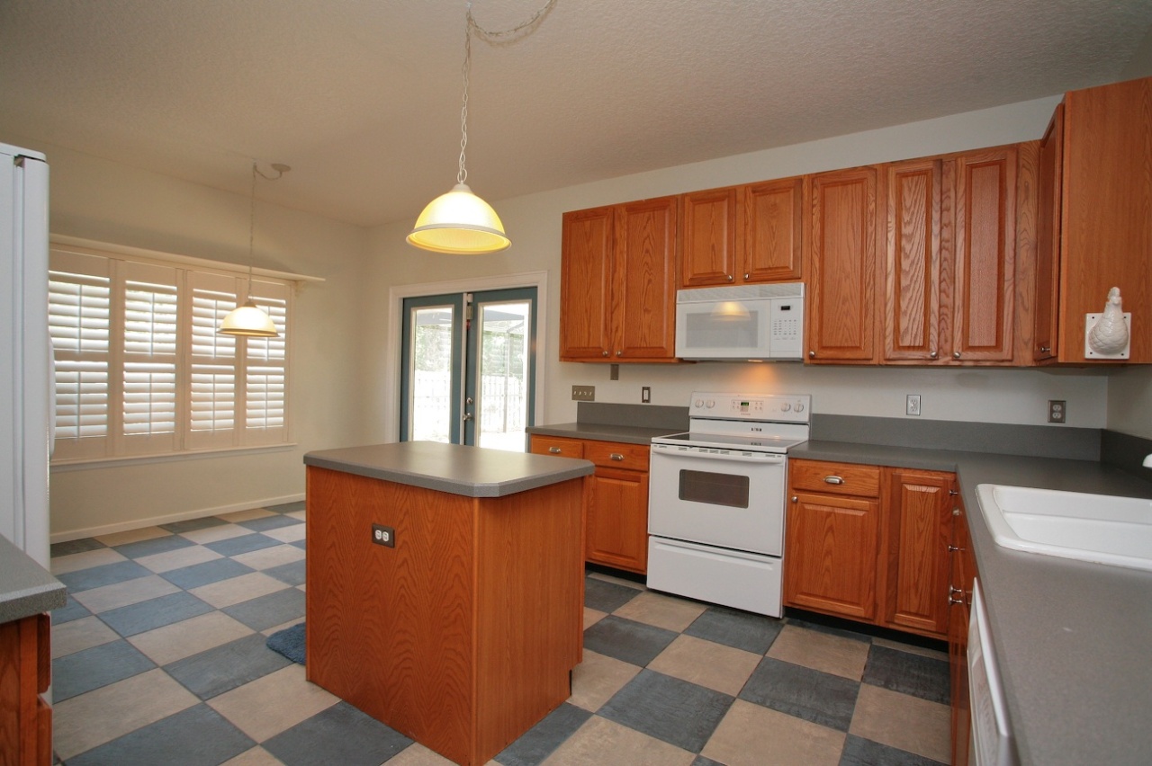 2536 Benjamin Road Jacksonville, FL 32223 - Photo 6 of 25 a kitchen with stainless steel appliances granite countertop a stove a sink and a microwave
