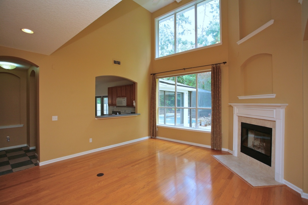 2536 Benjamin Road Jacksonville, FL 32223 - Photo 8 of 25 a view of an empty room with a fireplace and a window
