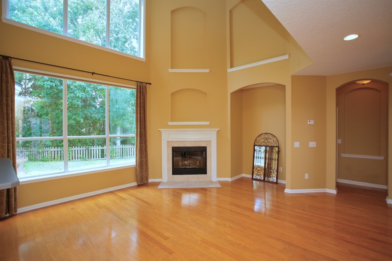 2536 Benjamin Road Jacksonville, FL 32223 - Photo 9 of 25 a view of an empty room with a window and a fireplace