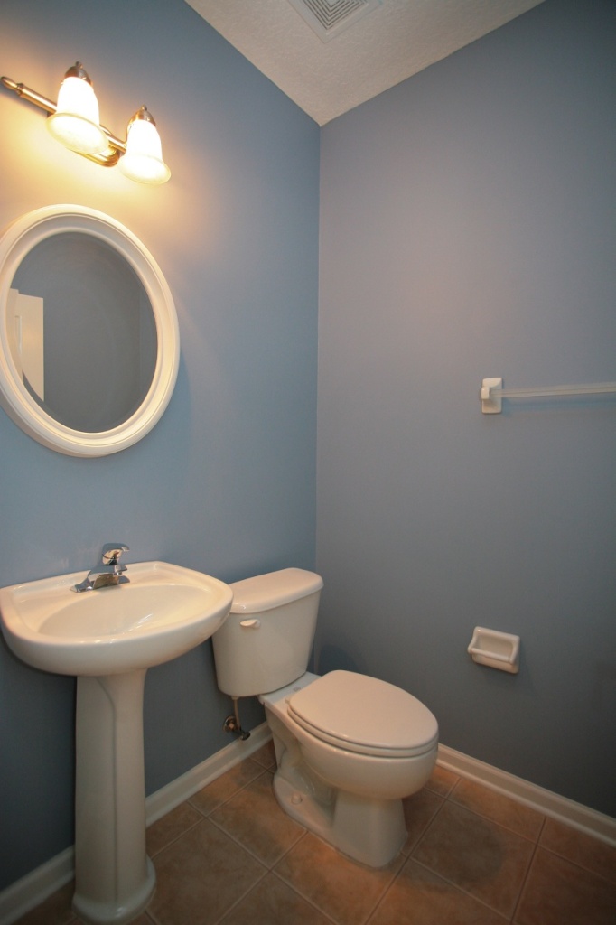 2536 Benjamin Road Jacksonville, FL 32223 - Photo 10 of 25 a white toilet sitting next to a bathroom sink