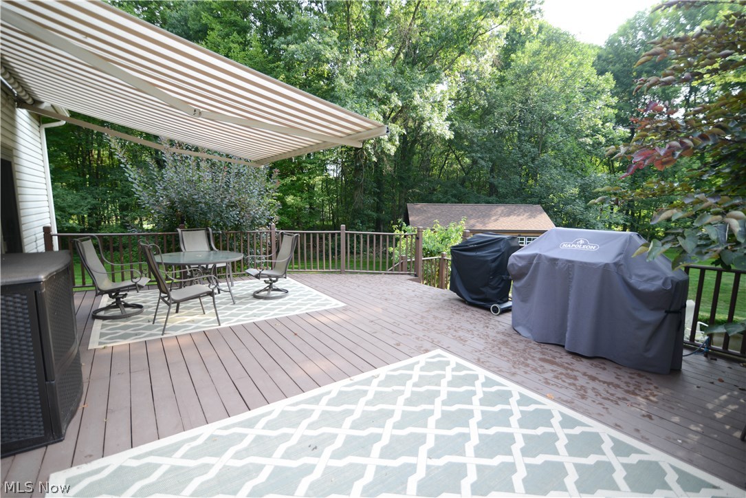 Deck on back of home with retractable awning