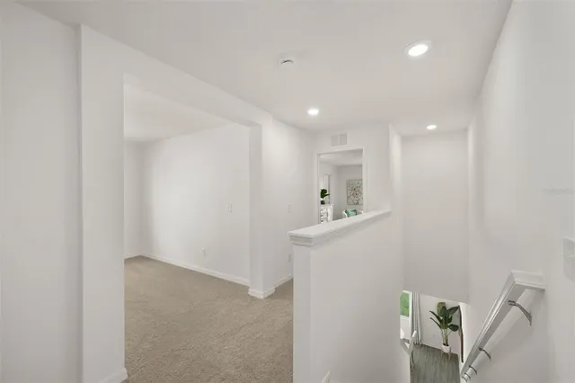 a view of hallway with furniture