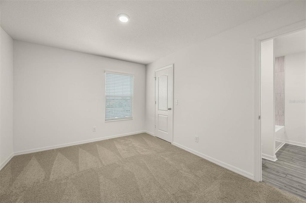 685 Poppy Lane Dundee, FL 33838 - Photo 27 of 31 an empty room with a empty space and windows