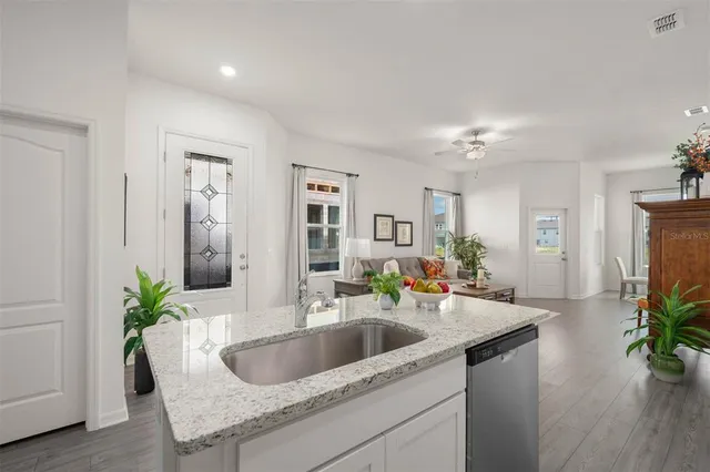 a kitchen with a sink and a refrigerator