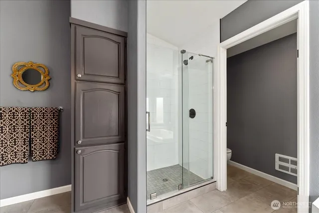 a white bath tub sitting next to a window