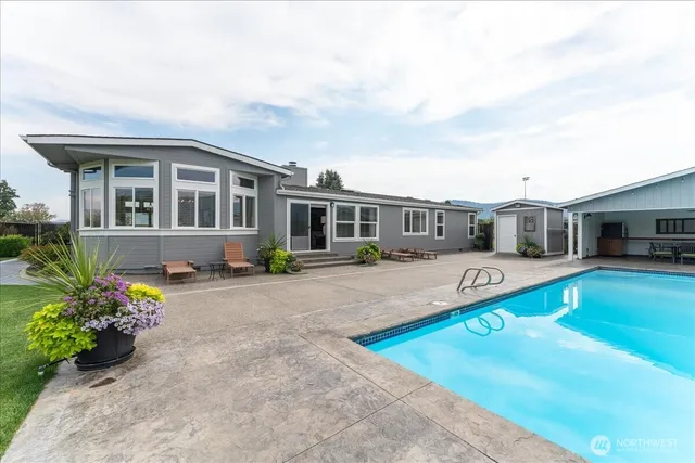 a front view of house with yard and seating area