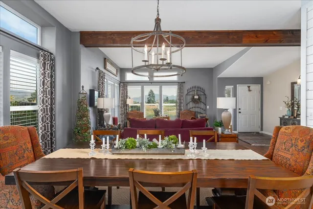 a view of a dining room with furniture window and outside view