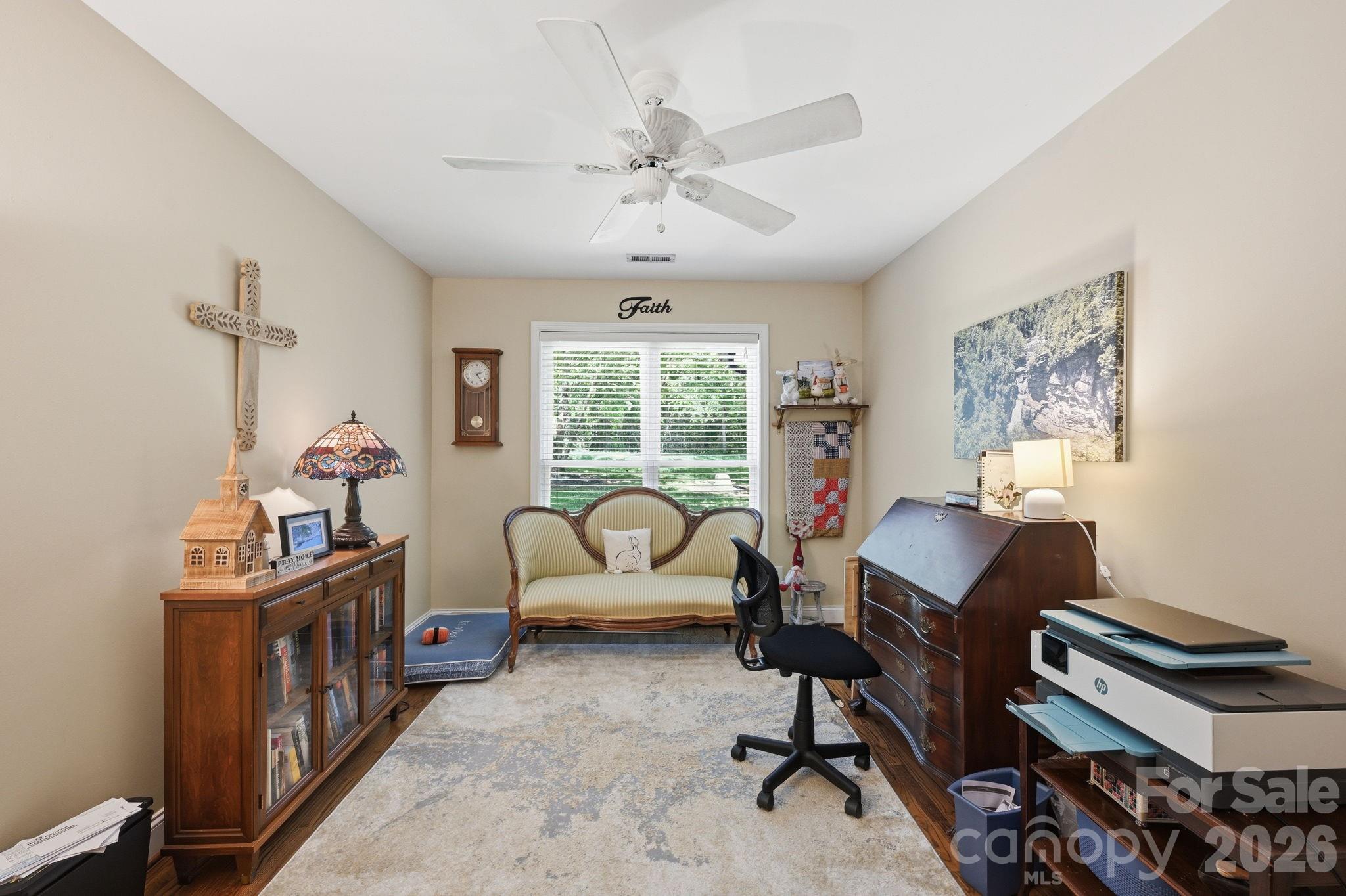 145 Upper Spencer Mountain Road Stanley, NC 28164 - Photo 11 of 29 a view of a workspace with furniture and a window