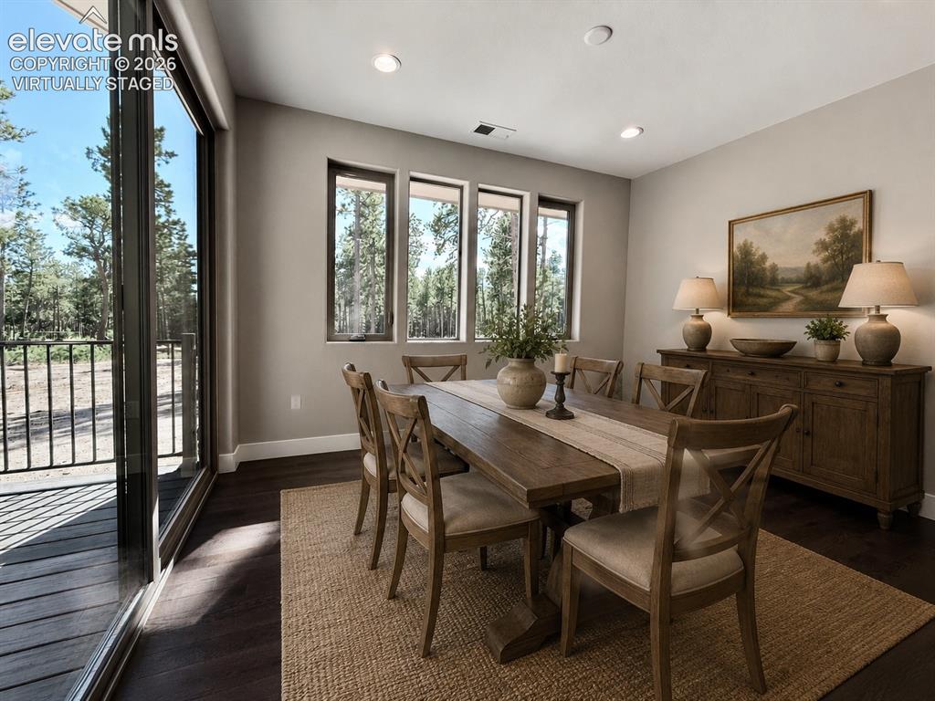 3145 Promise Point Colorado Springs, CO 80921 - Photo 8 of 28 Dining Room with Deck Access. Virtually Staged.