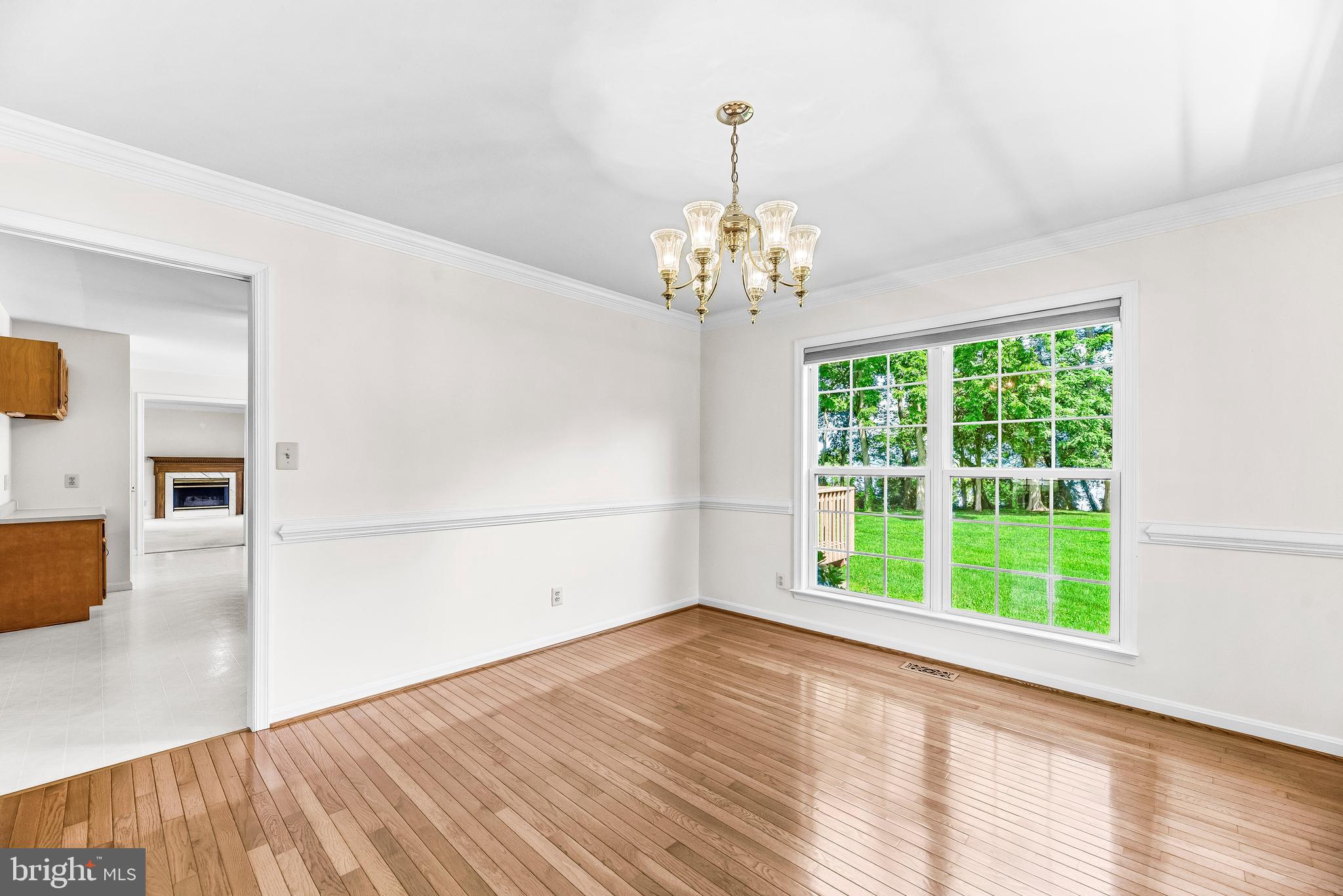 5965 Ketch Road Prince Frederick, MD 20678 - Photo 12 of 56 a view of empty room with wooden floor and fan
