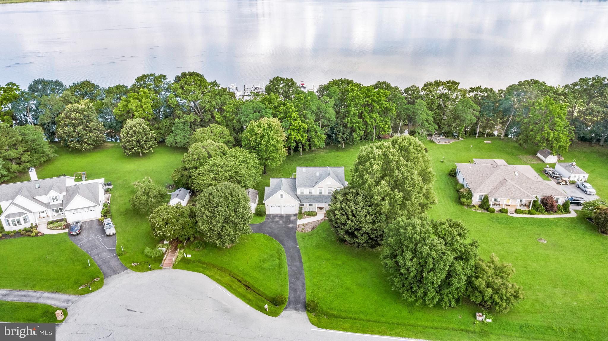 5965 Ketch Road Prince Frederick, MD 20678 - Photo 2 of 56 an aerial view of a house with garden space and trees all around