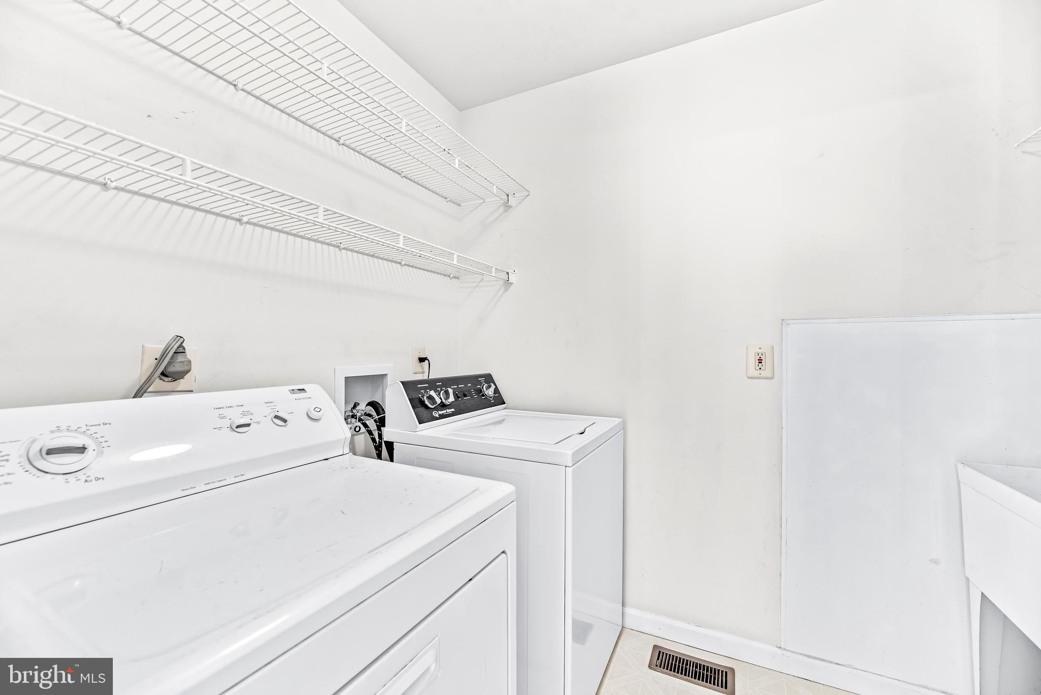5965 Ketch Road Prince Frederick, MD 20678 - Photo 25 of 56 a utility room with dryer and washer