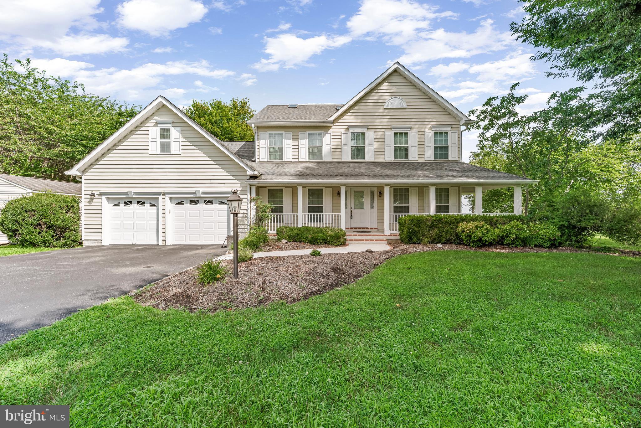 5965 Ketch Road Prince Frederick, MD 20678 - Photo 3 of 56 a front view of a house with a yard and trees