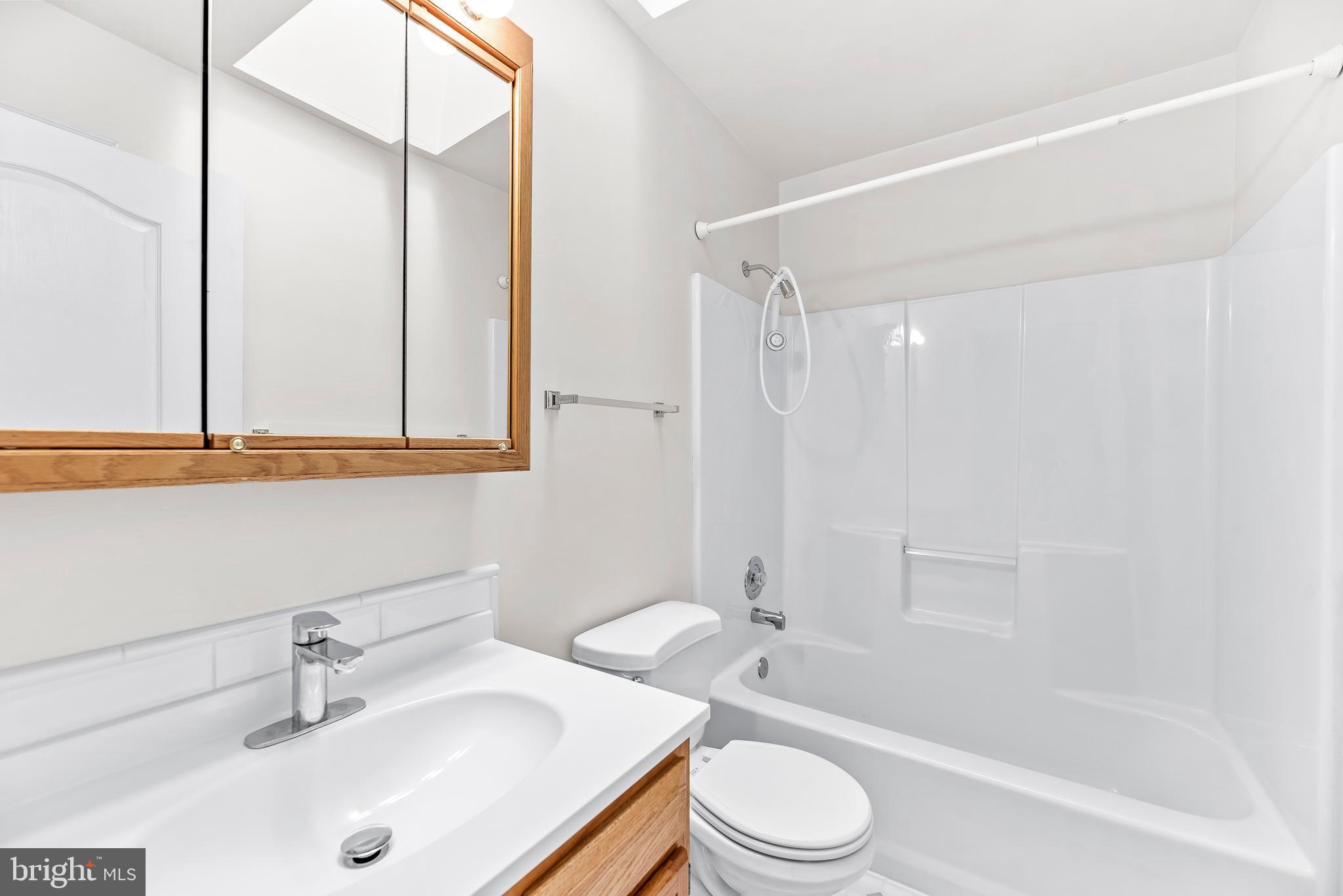 5965 Ketch Road Prince Frederick, MD 20678 - Photo 35 of 56 a bathroom with a sink a toilet and shower