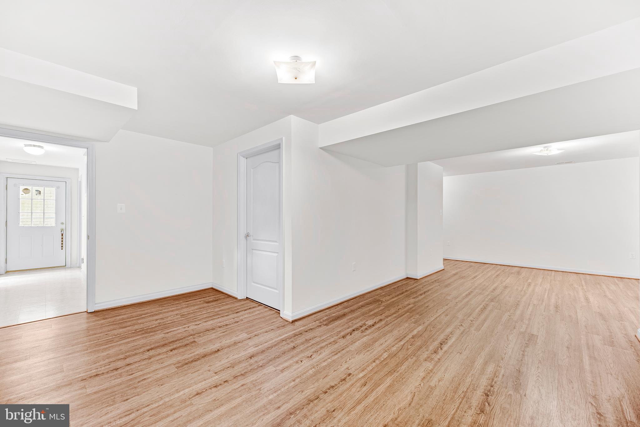 5965 Ketch Road Prince Frederick, MD 20678 - Photo 37 of 56 wooden floor in an empty room with a workspace