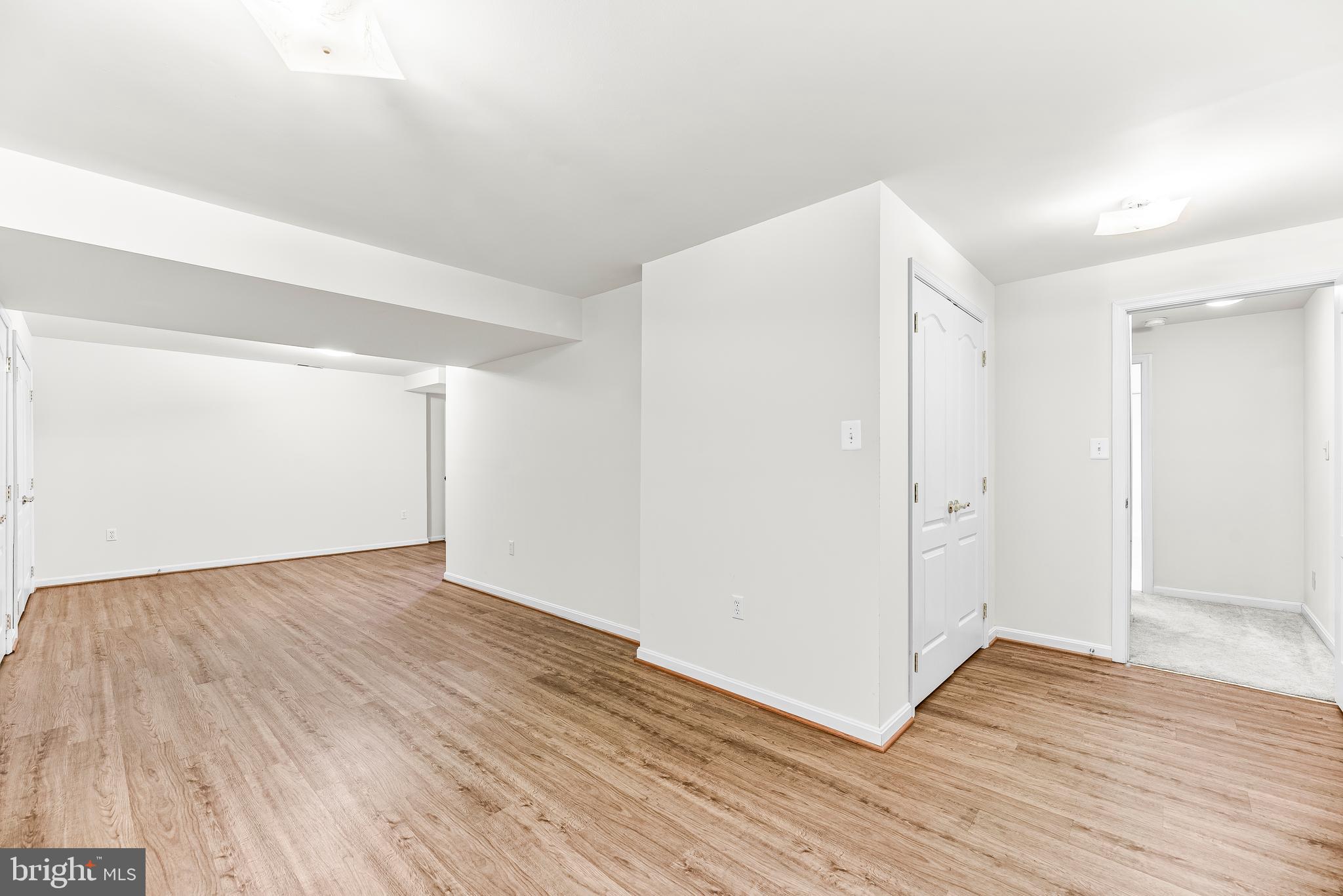 5965 Ketch Road Prince Frederick, MD 20678 - Photo 38 of 56 a view of an empty room with wooden floor