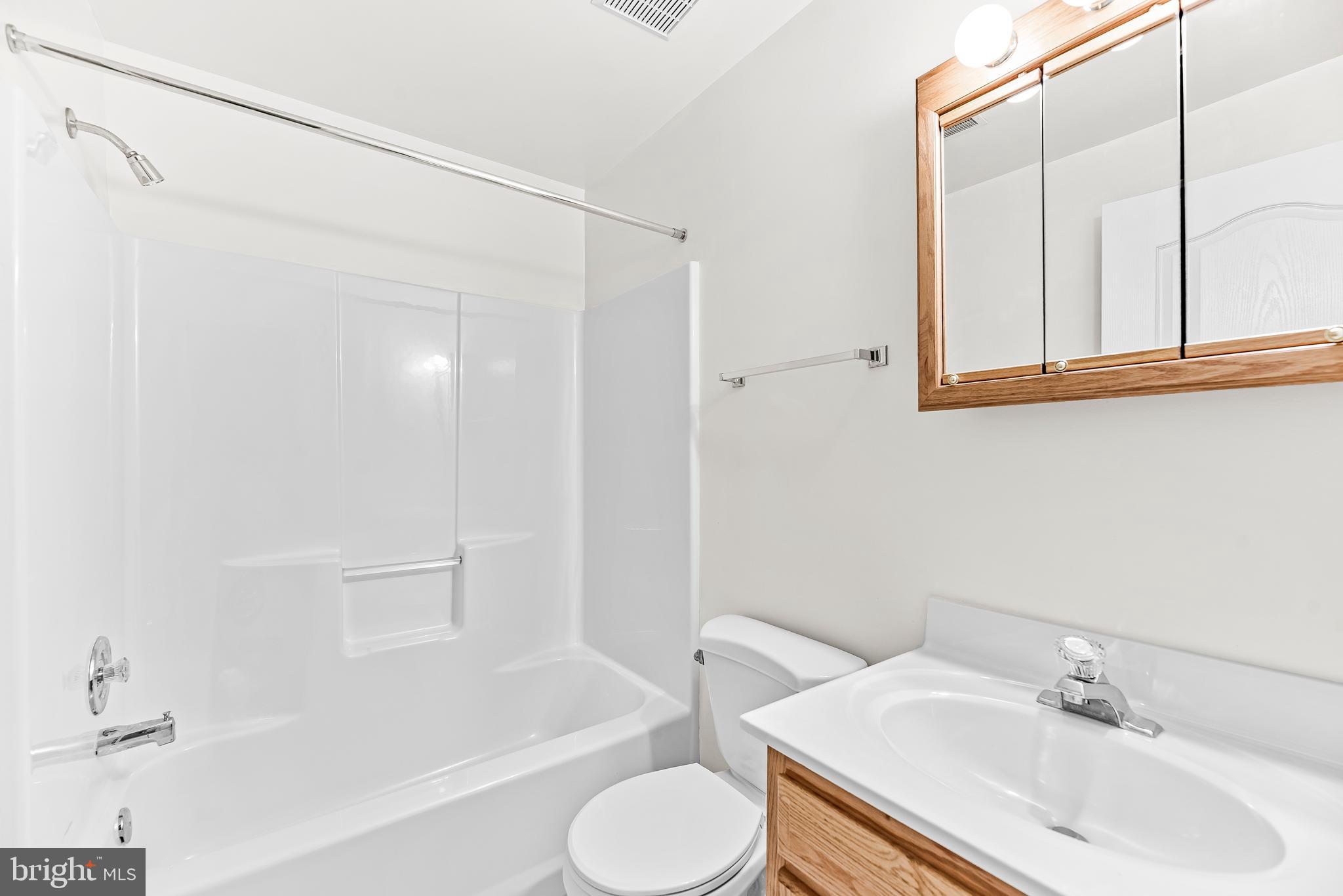 5965 Ketch Road Prince Frederick, MD 20678 - Photo 42 of 56 a bathroom with a sink toilet and shower