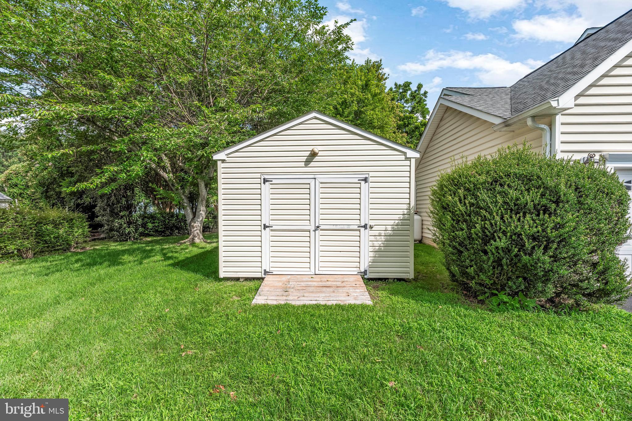 5965 Ketch Road Prince Frederick, MD 20678 - Photo 44 of 56 a view of a house with a yard and plants
