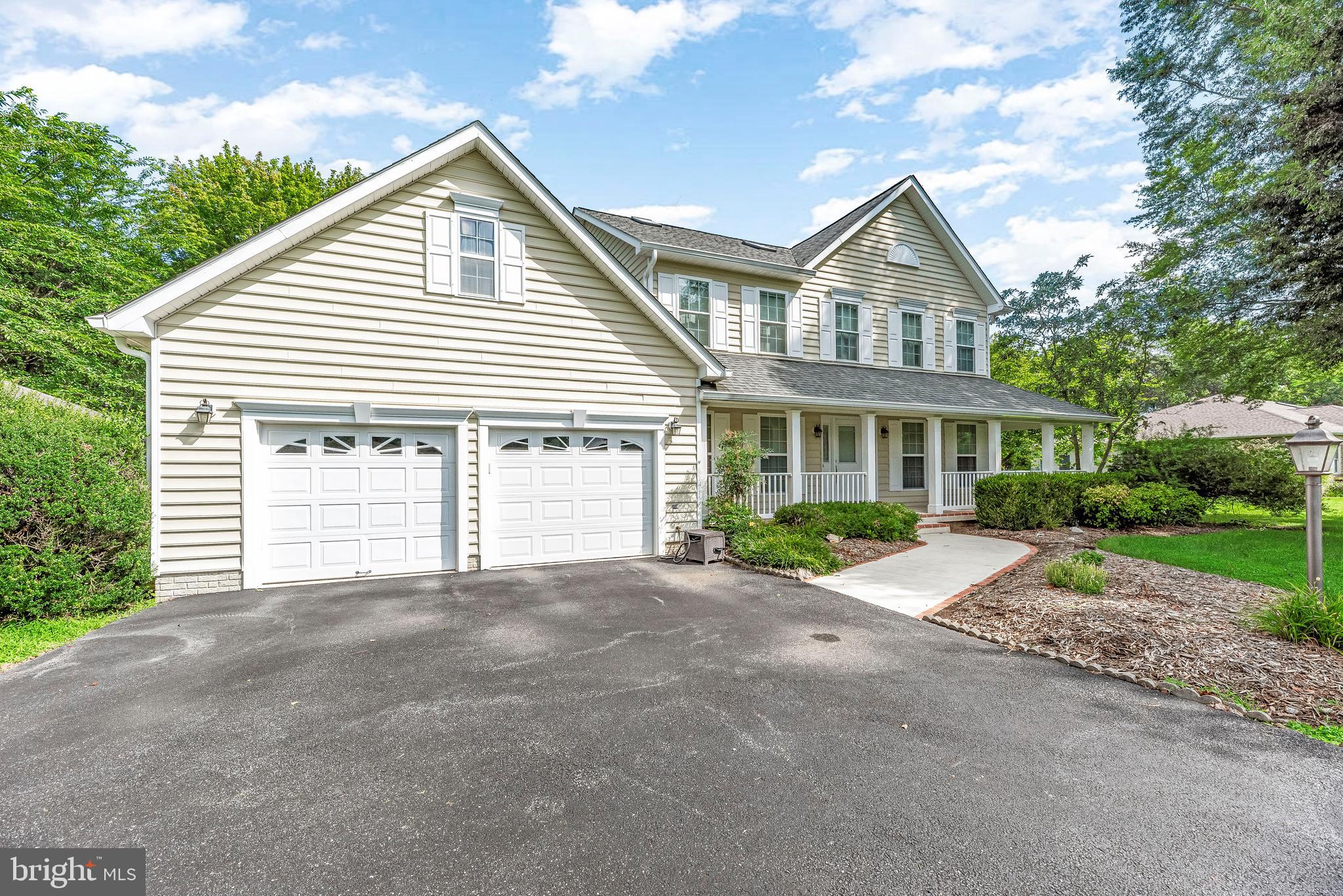 5965 Ketch Road Prince Frederick, MD 20678 - Photo 5 of 56 a front view of a house with a yard and garage