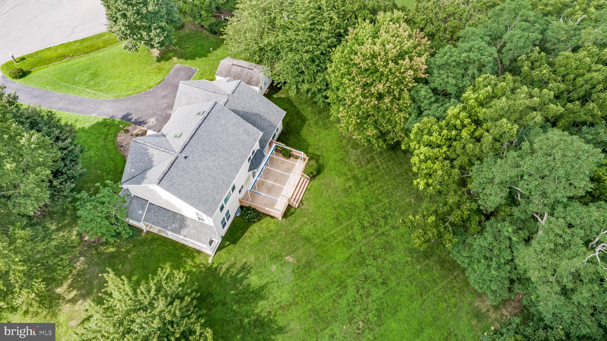 5965 Ketch Road Prince Frederick, MD 20678 - Photo 54 of 56 an aerial view of a house with a garden and trees