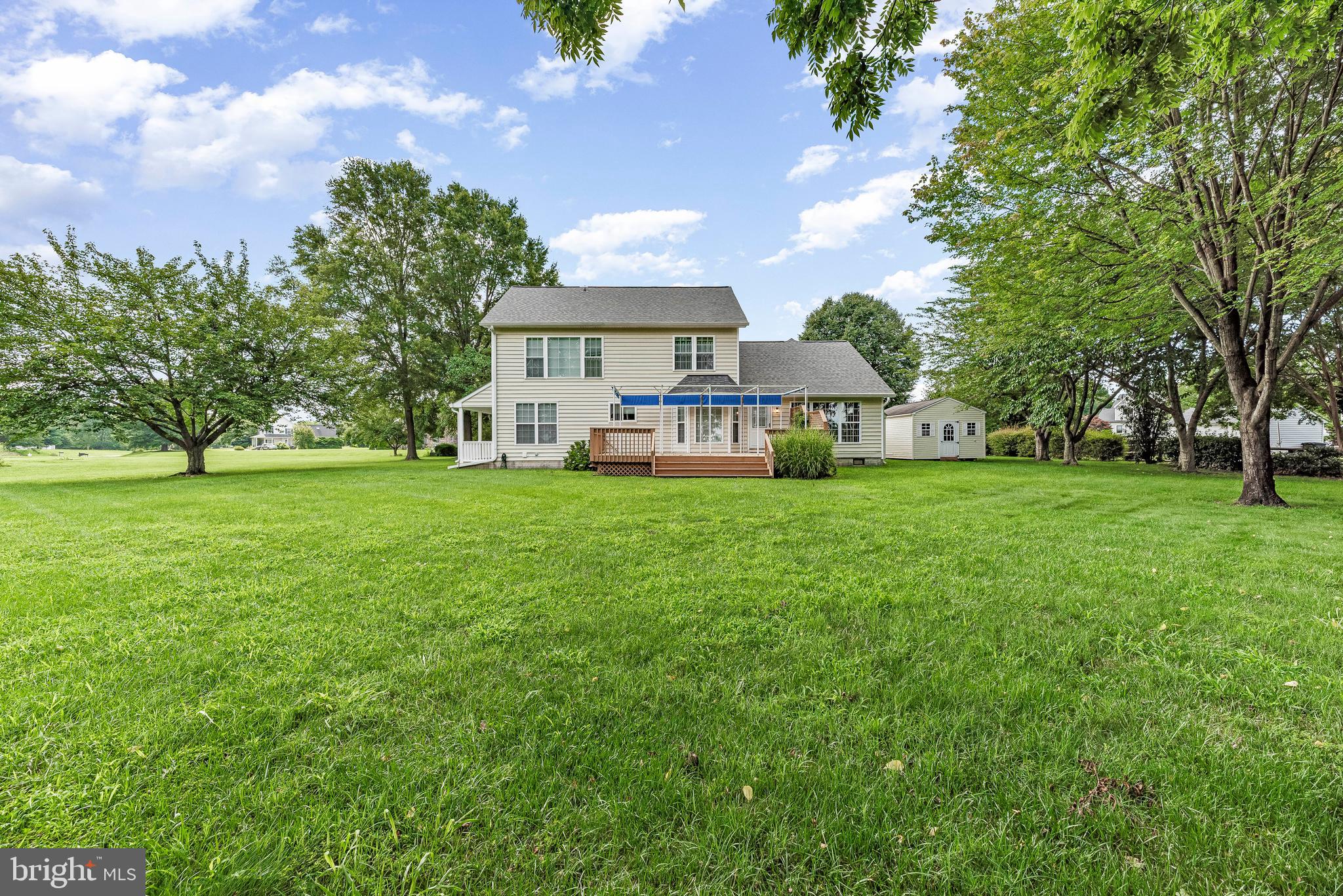 5965 Ketch Road Prince Frederick, MD 20678 - Photo 8 of 56 a view of a house with a big yard and large trees