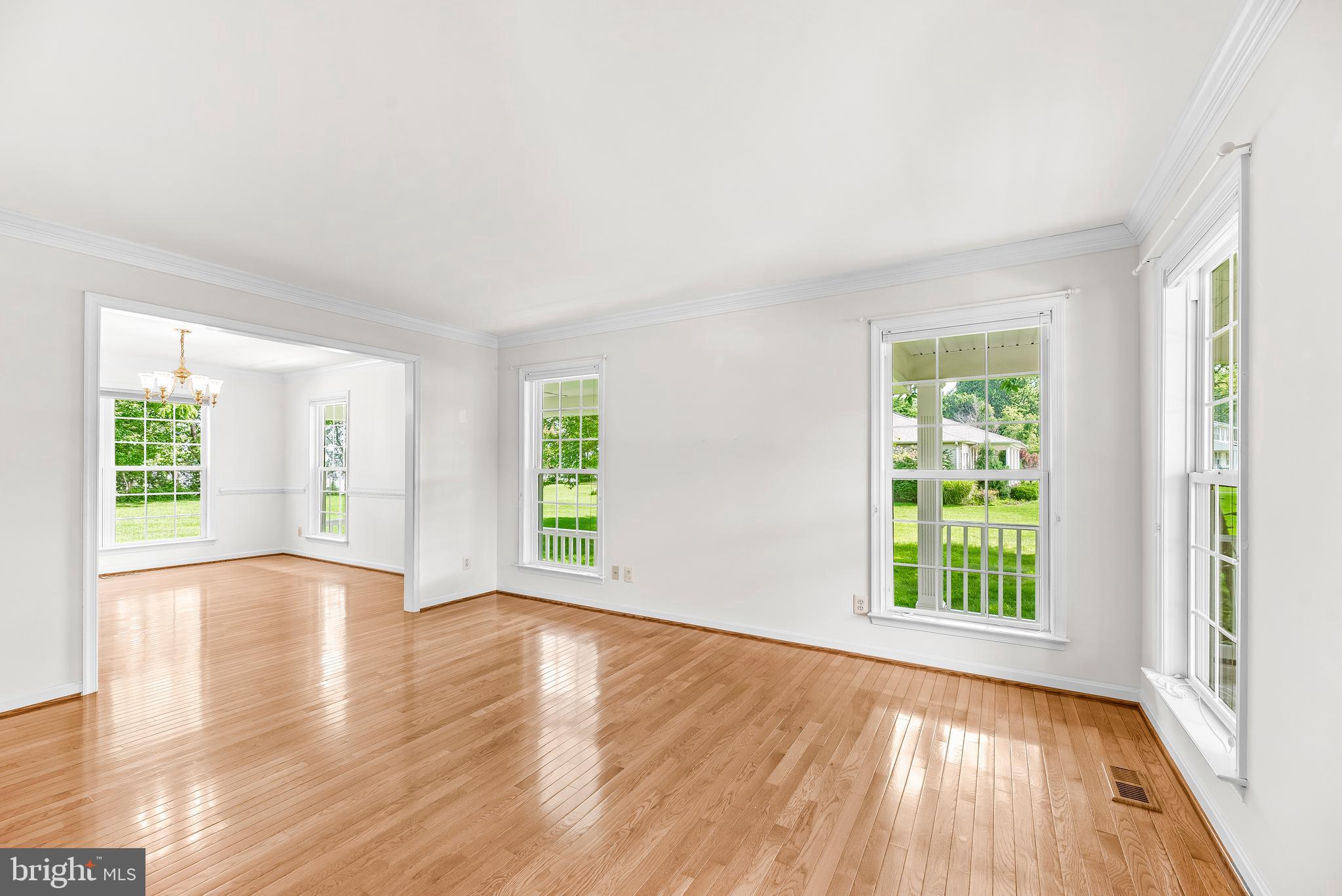 5965 Ketch Road Prince Frederick, MD 20678 - Photo 10 of 56 an empty room with wooden floor and windows