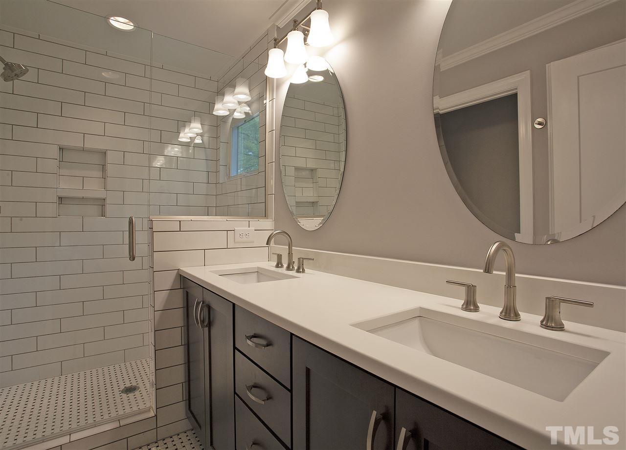 125 Plainview Avenue Raleigh, NC 27604 - Photo 15 of 27 a bathroom with a double vanity sink and a mirror