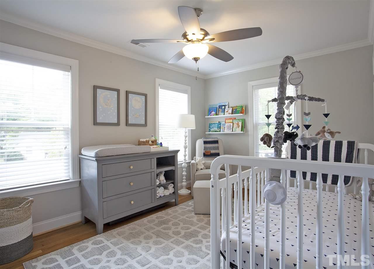 125 Plainview Avenue Raleigh, NC 27604 - Photo 18 of 27 a room with furniture a chandelier and a window