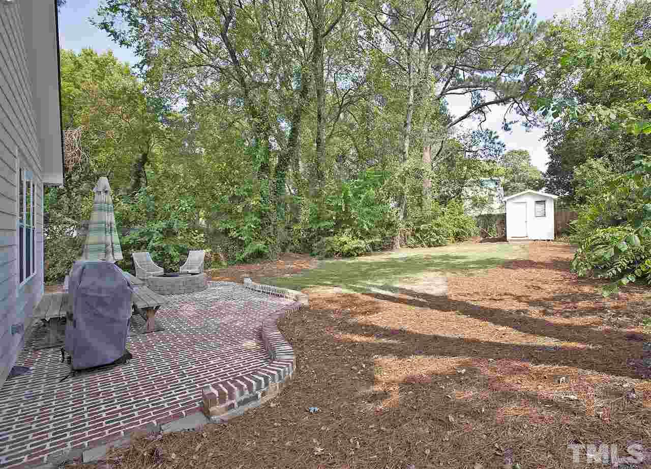 125 Plainview Avenue Raleigh, NC 27604 - Photo 25 of 27 a view of a house with backyard and a tree