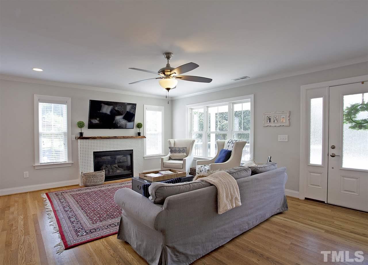 125 Plainview Avenue Raleigh, NC 27604 - Photo 4 of 27 a living room with furniture fireplace and a flat screen tv