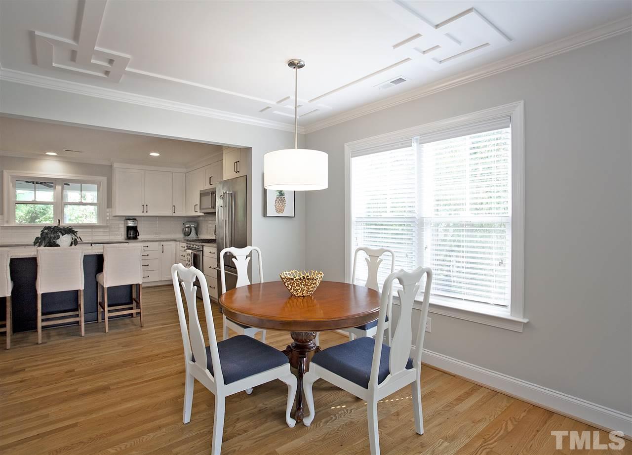 125 Plainview Avenue Raleigh, NC 27604 - Photo 8 of 27 a view of a dining room with furniture windows and wooden floor