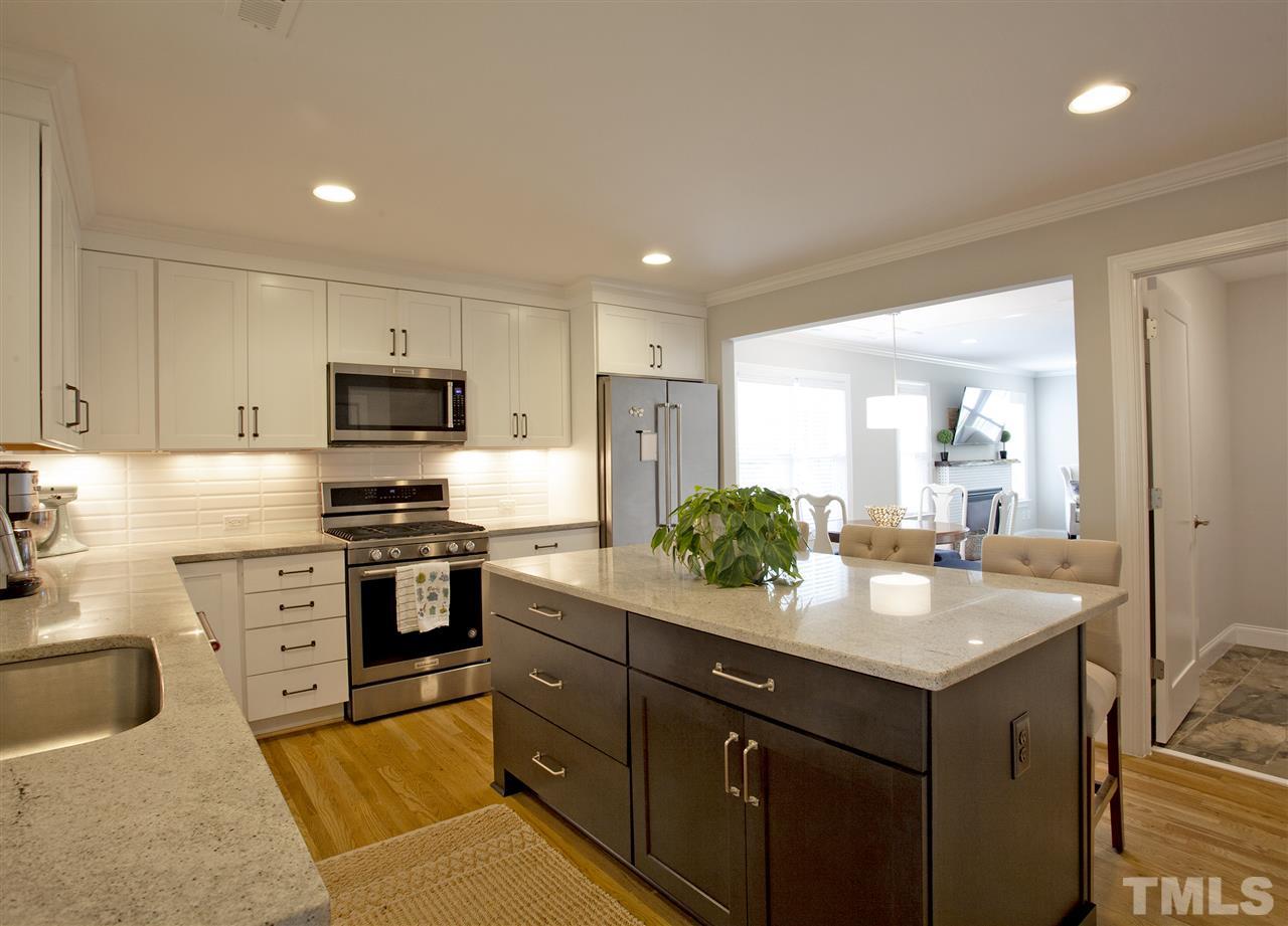 125 Plainview Avenue Raleigh, NC 27604 - Photo 10 of 27 a kitchen with a sink stove and refrigerator
